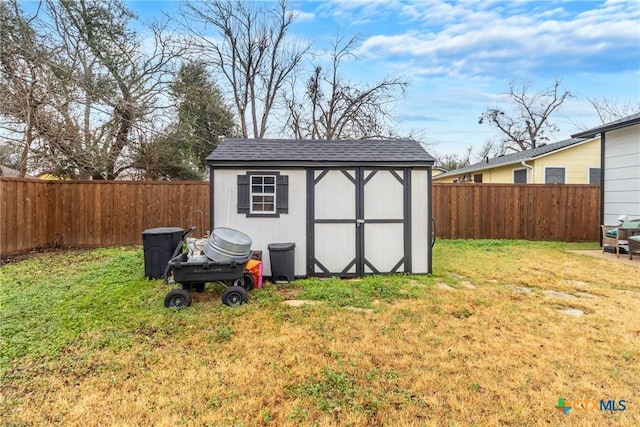 view of shed featuring a fenced backyard