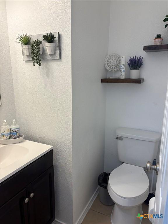 5902 Chuckwagon Cir, Killeen, TX 76542 - half bathroom featuring vanity, tile patterned flooring, and toilet