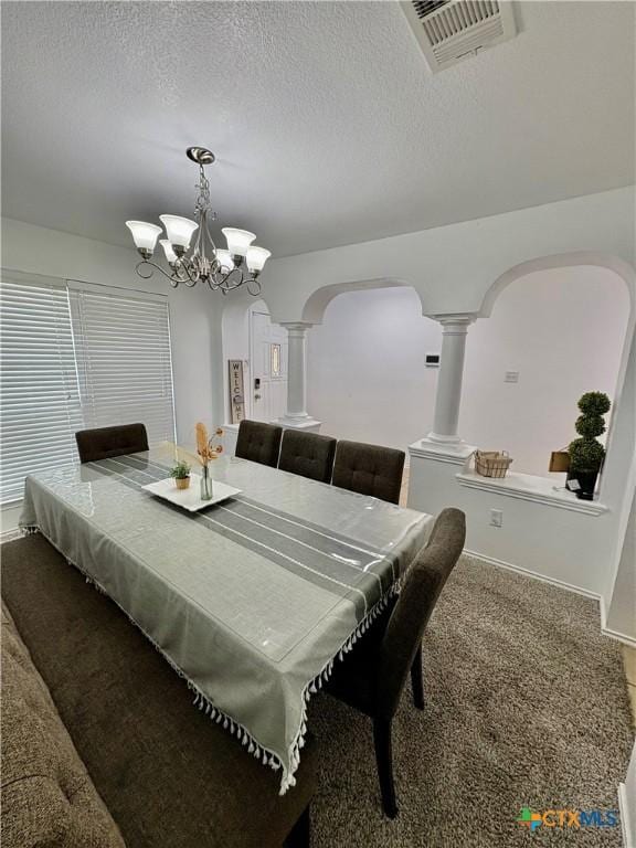 5902 Chuckwagon Cir, Killeen, TX 76542 - dining space featuring decorative columns, arched walkways, a textured ceiling, and a chandelier
