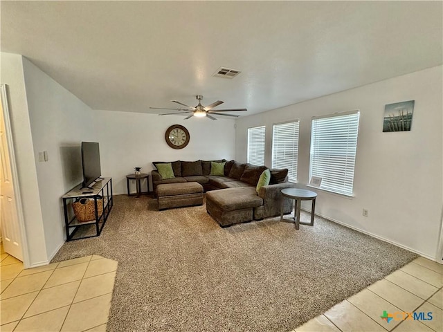 5902 Chuckwagon Cir, Killeen, TX 76542 - living room featuring light tile patterned flooring, light carpet, a ceiling fan, and baseboards