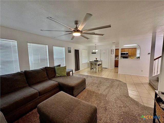 5902 Chuckwagon Cir, Killeen, TX 76542 - living area with light tile patterned floors, ceiling fan, and stairs