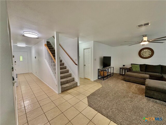 5902 Chuckwagon Cir, Killeen, TX 76542 - living area with light tile patterned flooring, stairway, a ceiling fan, and baseboards