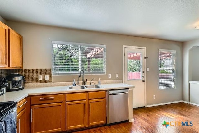 25923 Torch Lily, San Antonio, TX 78260 - kitchen with stainless steel appliances, a sink, plenty of natural light, and wood finished floors