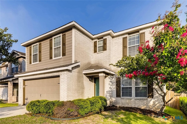 25923 Torch Lily, San Antonio, TX 78260 - view of front of house with brick siding, an attached garage, fence, and driveway