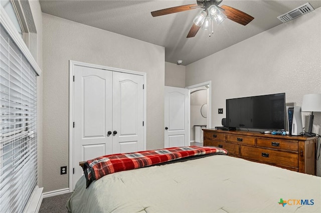 bedroom featuring carpet flooring, ceiling fan, and a closet