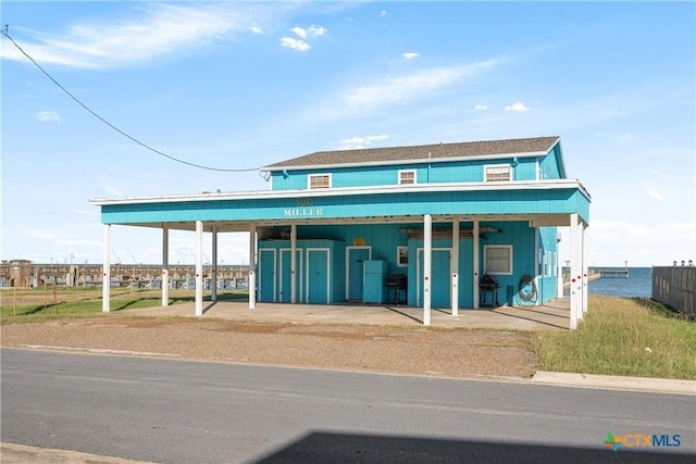 view of front facade with a water view