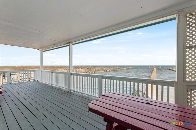 wooden deck with a water view