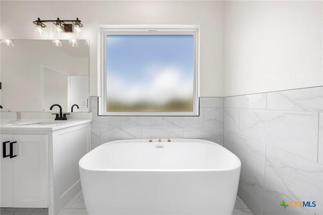 15938 Salado Dr, Temple, TX 76502 - full bath featuring vanity, a soaking tub, tile walls, and marble finish flooring