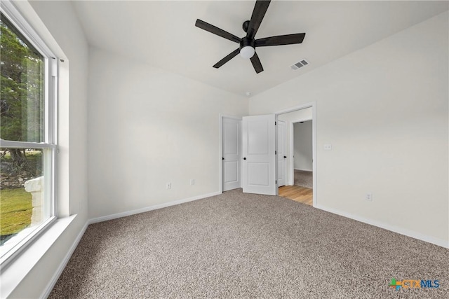 15938 Salado Dr, Temple, TX 76502 - unfurnished bedroom featuring light colored carpet, lofted ceiling, and ceiling fan