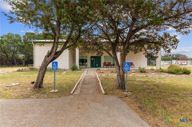 15938 Salado Dr, Temple, TX 76502 - view of front facade with brick siding and a front lawn