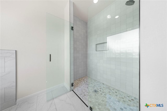 15938 Salado Dr, Temple, TX 76502 - bathroom featuring a stall shower and marble finish floors