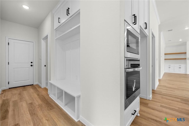 15938 Salado Dr, Temple, TX 76502 - mudroom featuring light wood finished floors and recessed lighting
