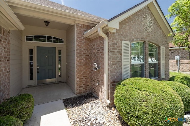 7617 Amber Meadow Loop, Temple, TX 76502 - view of exterior entry featuring brick siding and a shingled roof