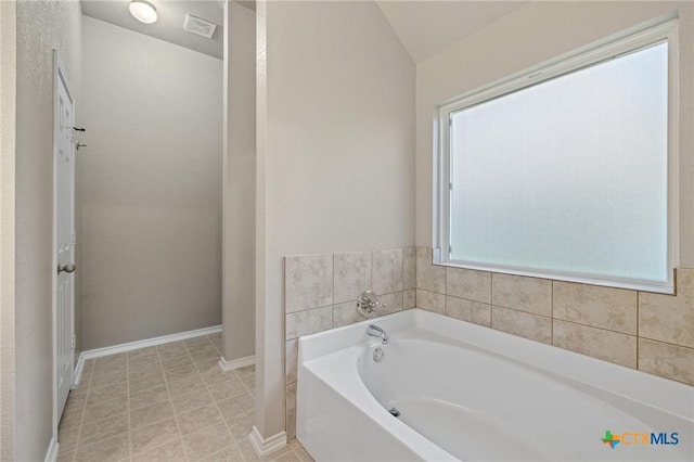 7617 Amber Meadow Loop, Temple, TX 76502 - bathroom with a bath and baseboards