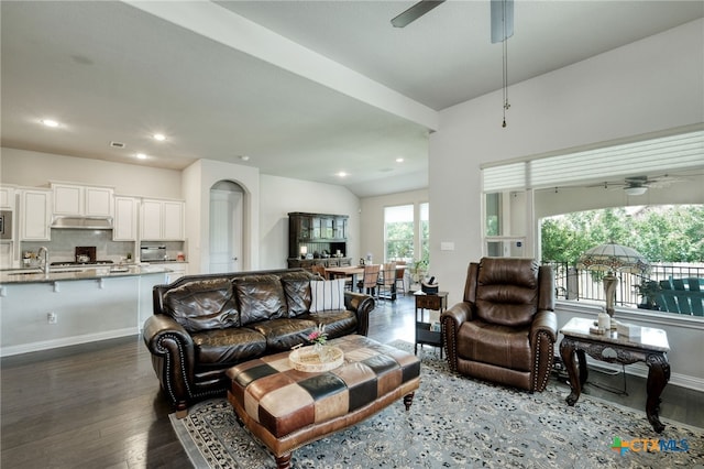 living area featuring a ceiling fan, wood finished floors, baseboards, and recessed lighting
