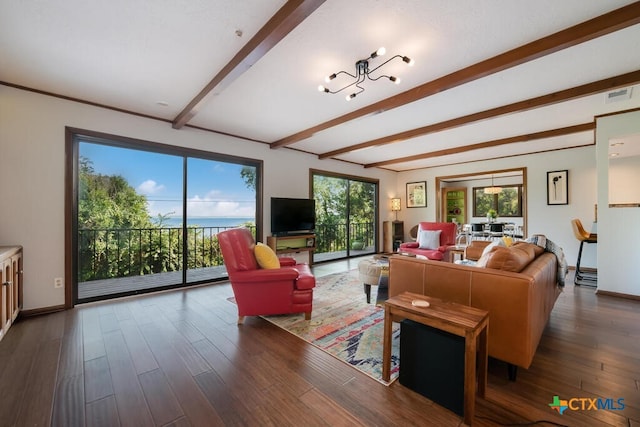 living room with beamed ceiling, wood finished floors, visible vents, and baseboards