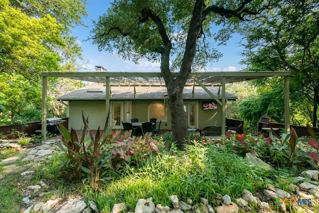 back of property with stucco siding