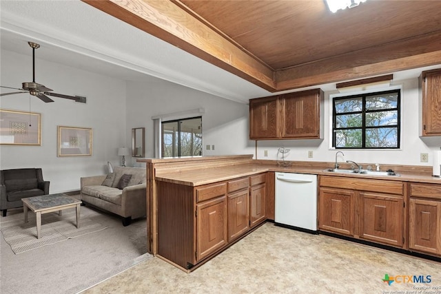 300 Ridge Crest Dr, Seguin, TX 78155 - kitchen with dishwasher, a sink, a peninsula, and healthy amount of natural light