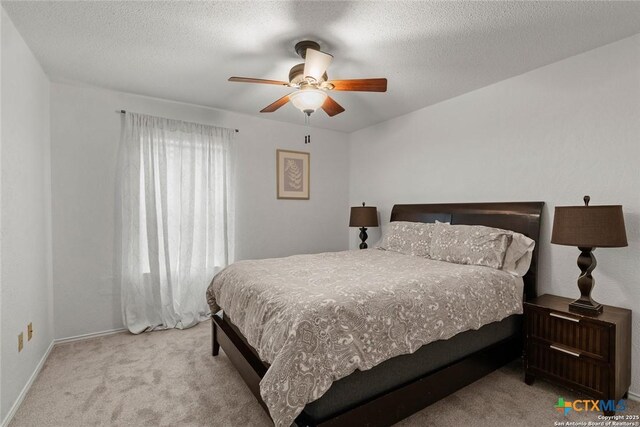 300 Ridge Crest Dr, Seguin, TX 78155 - bedroom with carpet flooring, ceiling fan, baseboards, and a textured ceiling