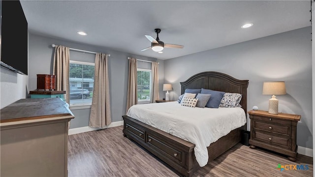 bedroom featuring ceiling fan and light hardwood / wood-style floors