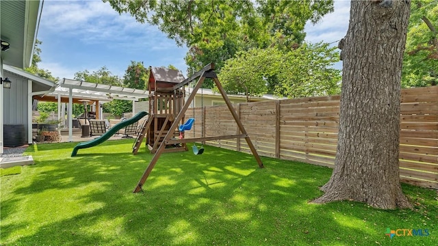 view of jungle gym with a yard and a fenced backyard