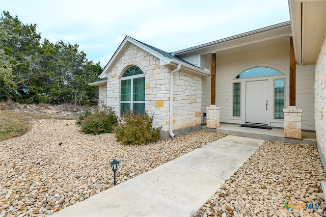 entrance to property with stone siding