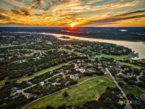 aerial view at dusk with a water view