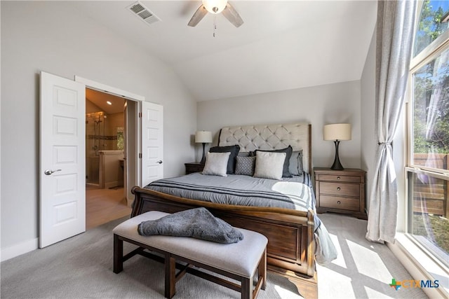 4001 Crockett Ave, Lago Vista, TX 78645 - bedroom featuring multiple windows, carpet flooring, vaulted ceiling, ensuite bath, and a ceiling fan