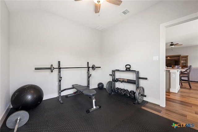 4001 Crockett Ave, Lago Vista, TX 78645 - exercise room featuring a ceiling fan, baseboards, wood finished floors, and vaulted ceiling