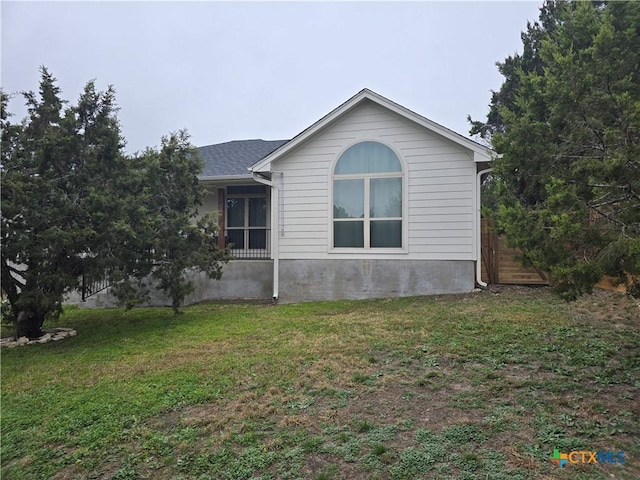 view of property exterior featuring a yard