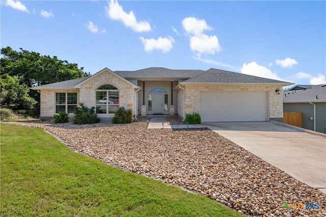 4001 Crockett Ave, Lago Vista, TX 78645 - ranch-style house featuring stone siding, a garage, driveway, a front lawn, and roof with shingles