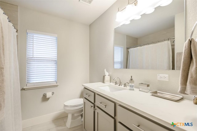 full bathroom with toilet, visible vents, baseboards, vanity, and tile patterned floors