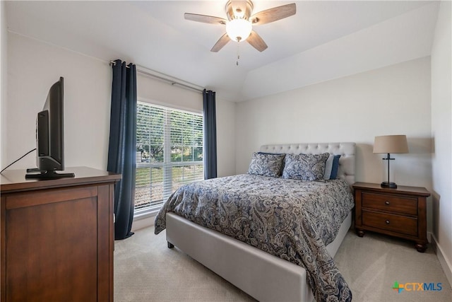 4001 Crockett Ave, Lago Vista, TX 78645 - bedroom with light carpet, vaulted ceiling, and a ceiling fan