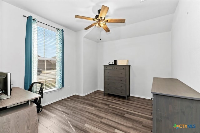home office featuring dark wood finished floors, baseboards, and ceiling fan