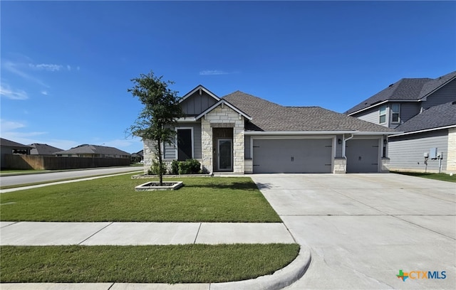 134 Nathaniel Dr, Taylor, TX 76574 - craftsman-style home with stone siding, an attached garage, a front yard, concrete driveway, and board and batten siding