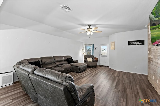 living area with a ceiling fan, baseboards, visible vents, and wood finished floors