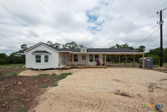 1907 Falconwood Dr, San Marcos, TX 78666 - view of front of house with a carport, a porch, and dirt driveway