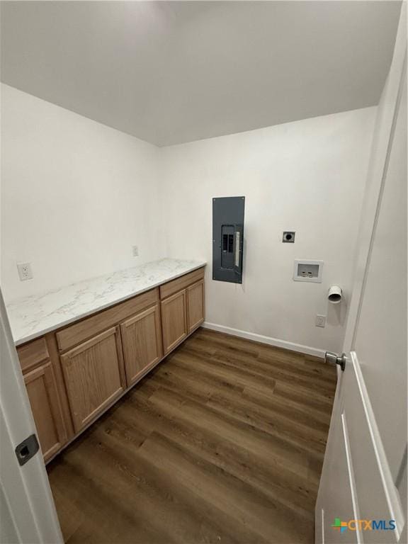 1907 Falconwood Dr, San Marcos, TX 78666 - laundry area with electric panel, dark wood-type flooring, hookup for an electric dryer, washer hookup, and baseboards