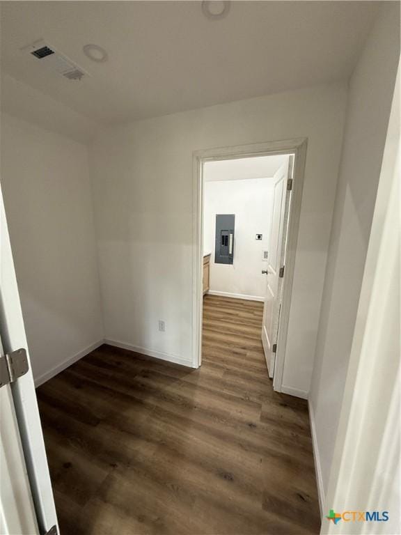 1907 Falconwood Dr, San Marcos, TX 78666 - empty room featuring dark wood finished floors, baseboards, and electric panel