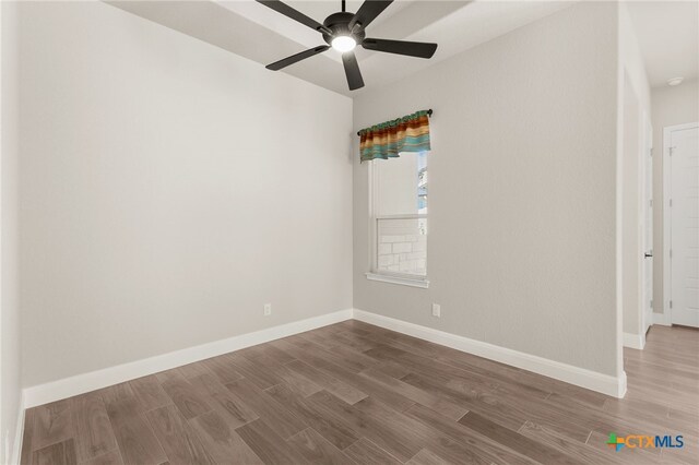 1125 Provence Pl, New Braunfels, TX 78132 - unfurnished room with wood finished floors, ceiling fan, and baseboards