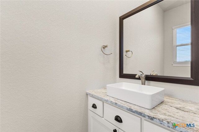 1125 Provence Pl, New Braunfels, TX 78132 - bathroom featuring vanity and a textured wall