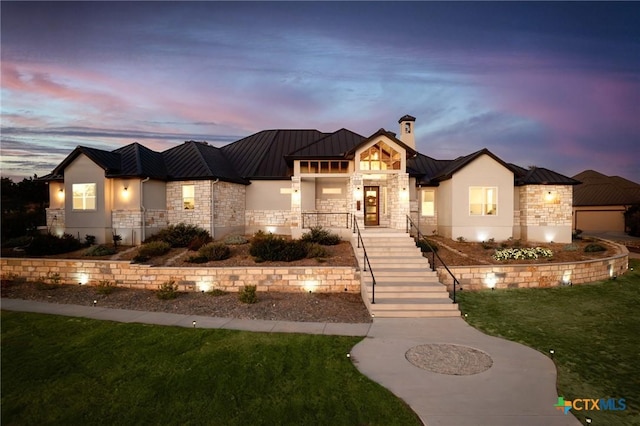 1125 Provence Pl, New Braunfels, TX 78132 - view of front of home featuring a standing seam roof, stone siding, and metal roof