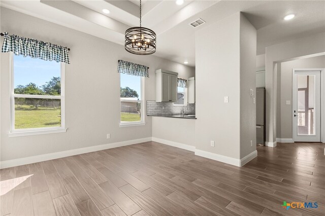 1125 Provence Pl, New Braunfels, TX 78132 - unfurnished dining area featuring a chandelier, dark wood-style flooring, recessed lighting, baseboards, and a sink
