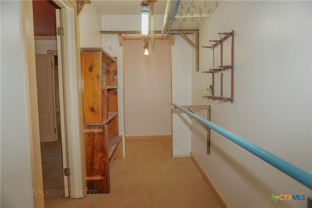 132 Madrona Ln, Bandera, TX 78003 - corridor featuring light carpet