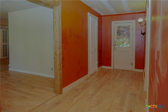 132 Madrona Ln, Bandera, TX 78003 - corridor featuring wood finished floors and baseboards
