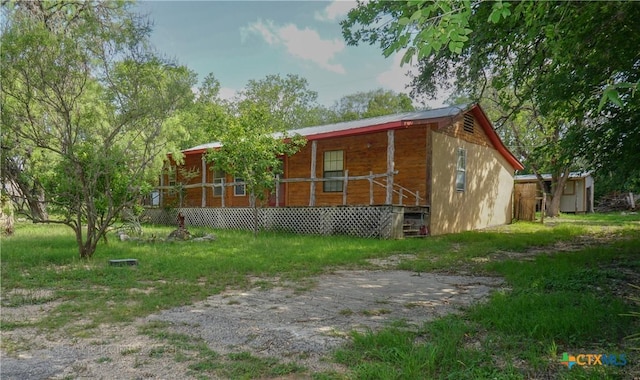 132 Madrona Ln, Bandera, TX 78003 - view of side of property with a porch