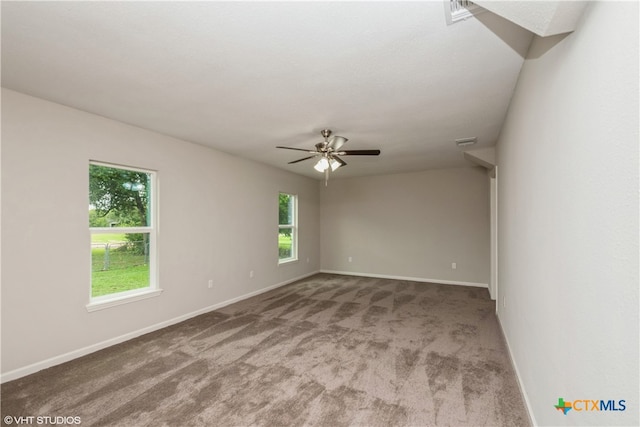 empty room featuring ceiling fan and carpet floors