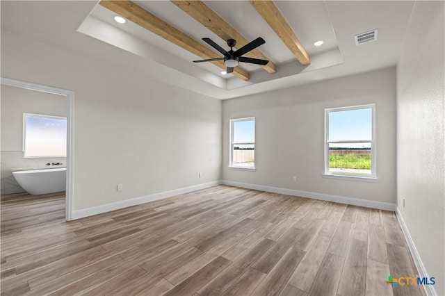 1811 Ember Dr, Temple, TX 76502 - spare room featuring light wood-type flooring, a tray ceiling, ceiling fan, beam ceiling, and recessed lighting
