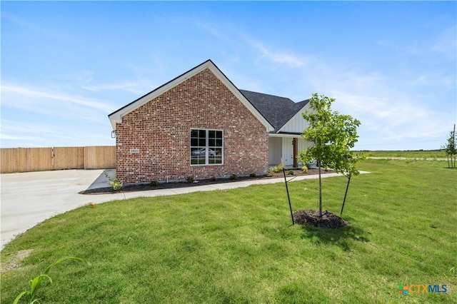 1811 Ember Dr, Temple, TX 76502 - view of front of home with brick siding and board and batten siding