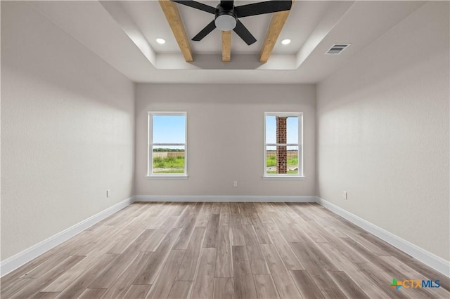1811 Ember Dr, Temple, TX 76502 - unfurnished room with light wood-style flooring, beam ceiling, a ceiling fan, recessed lighting, and a tray ceiling